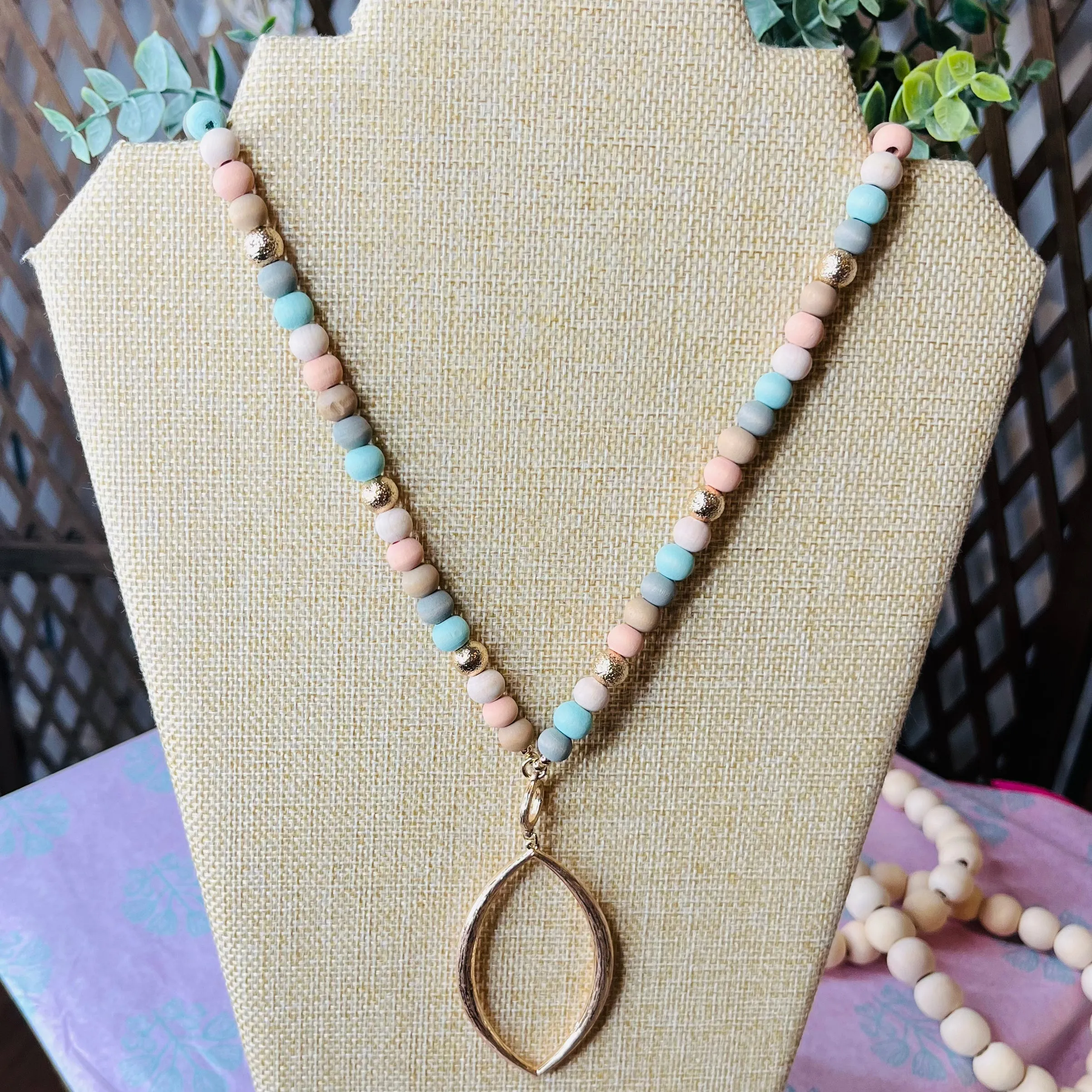 long pastel bead necklace w/ gold pendant