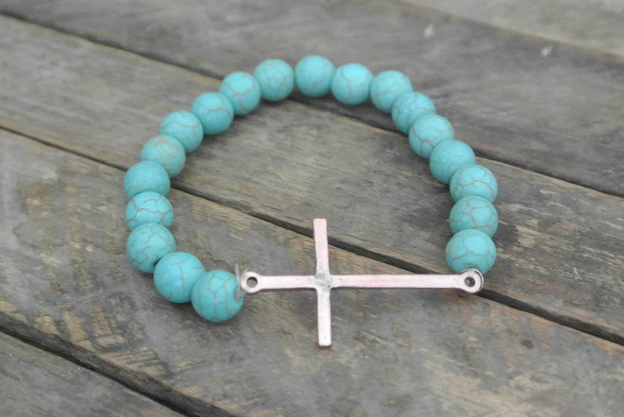 Turquoise beaded bracelet with Copper toned Sleek Cross Charm